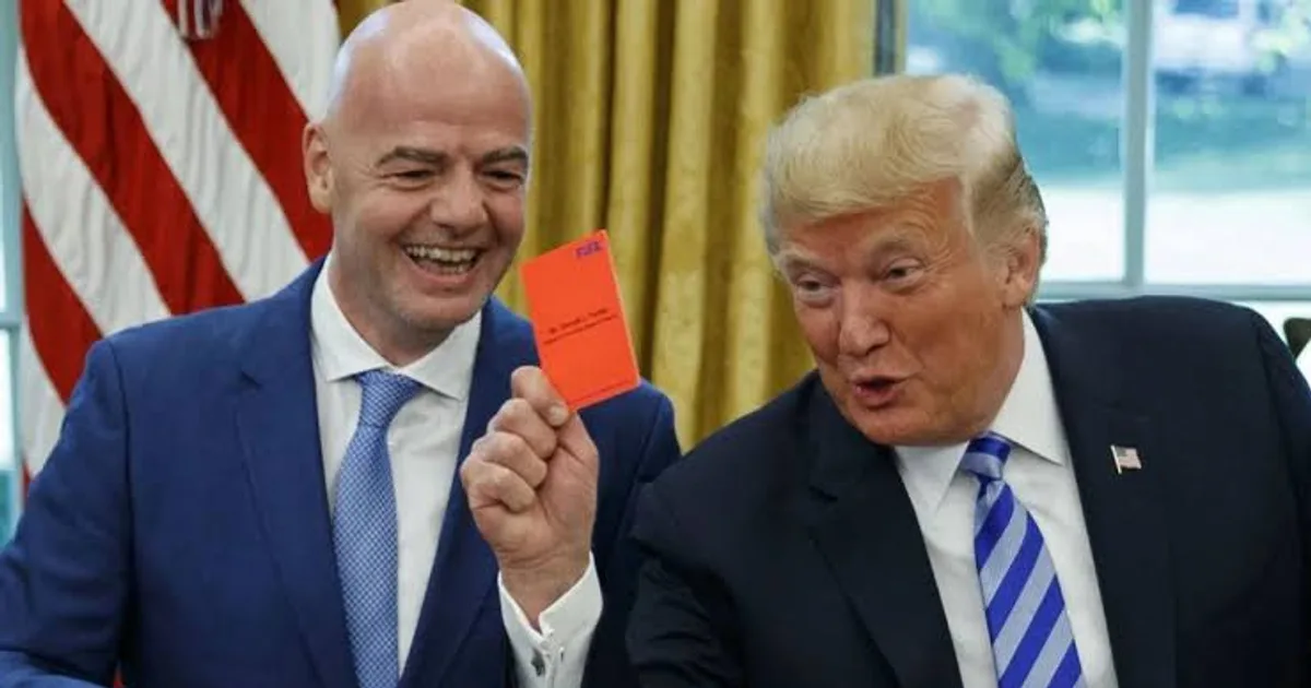 US President Donald Trump holds up a red card in the Oval Office, with an American flag behind him. FIFA president Gianni Infantino stands next to him.